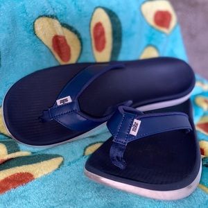 Nike blue flip flops
